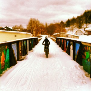 Fat biking across fitness trail bridge